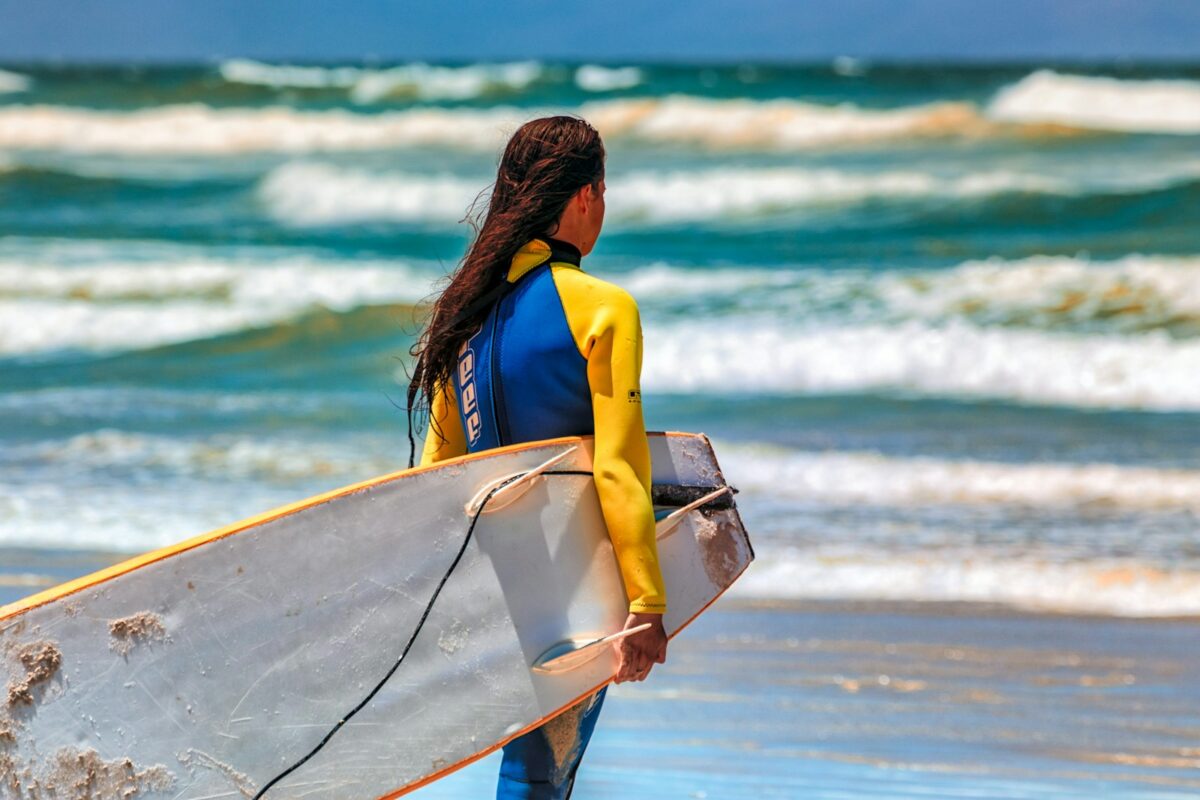 woman carrying surboard